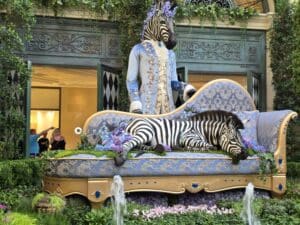 Zebra sleeping on a couch sculpture
