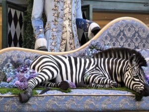 Zebra sleeping on a couch sculpture